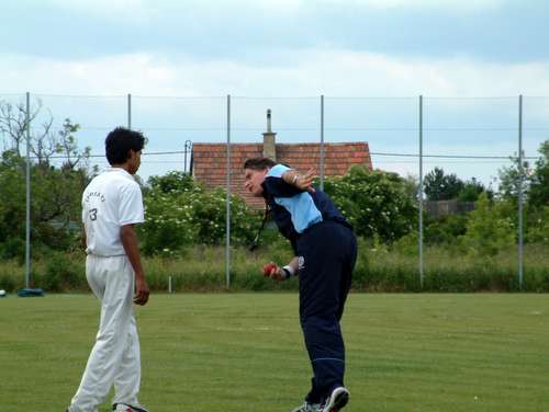 Stan Mortensen demonstrating the follow-through to Sahil Bharti